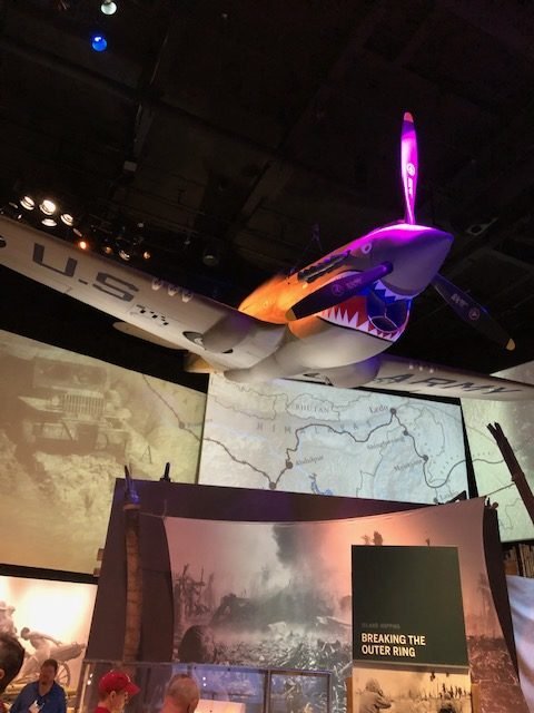 A shark-faced P-40 Warhawk hangs in the "Road to Tokyo" exhibit at the National World War II Museum in New Orleans, LA.